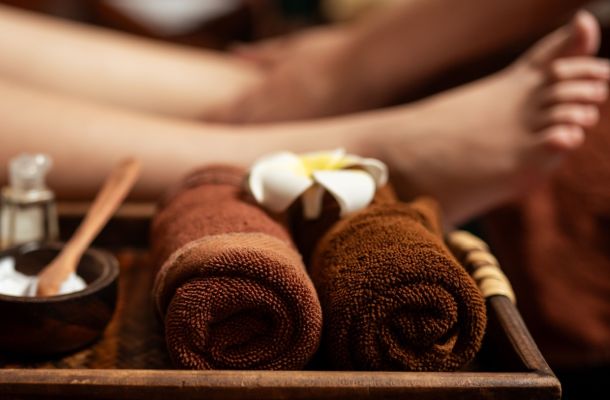 A massage therapist performing Houston reflexology