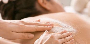 A client enjoying a Houston body scrub massage