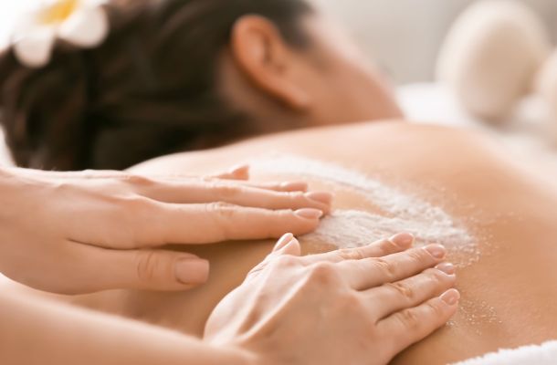 A client enjoying a Houston body scrub massage