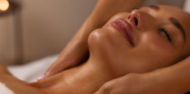 A woman getting a relaxing neck massage