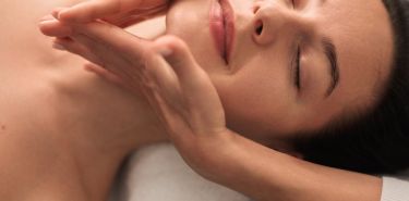A massage therapist performing Houston TMJ massage