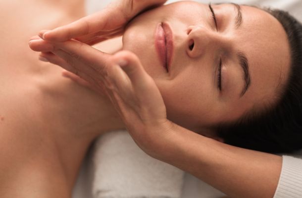 A massage therapist performing Houston TMJ massage