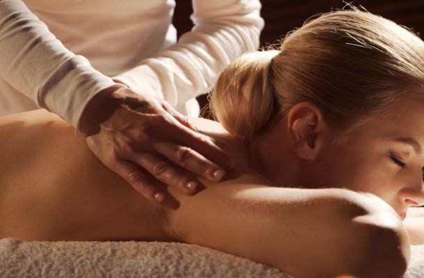 A woman getting a neck massage
