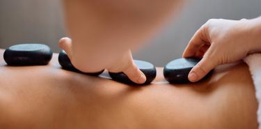 A client getting Houston hot stone therapy
